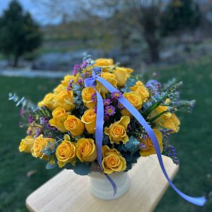 Yellow flower arrangement in a glass jar by Mrs. Lilac Flowers in Abbotsford